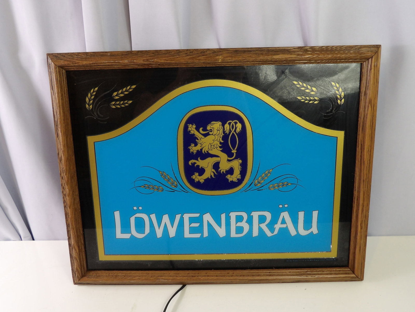 Lowenbrau Internally Lit Sign: 17" X 21" Lowenbrau Internally Lit Sign. All measurements approximate. Please see photos for condition and details. Selling as is from 04281.