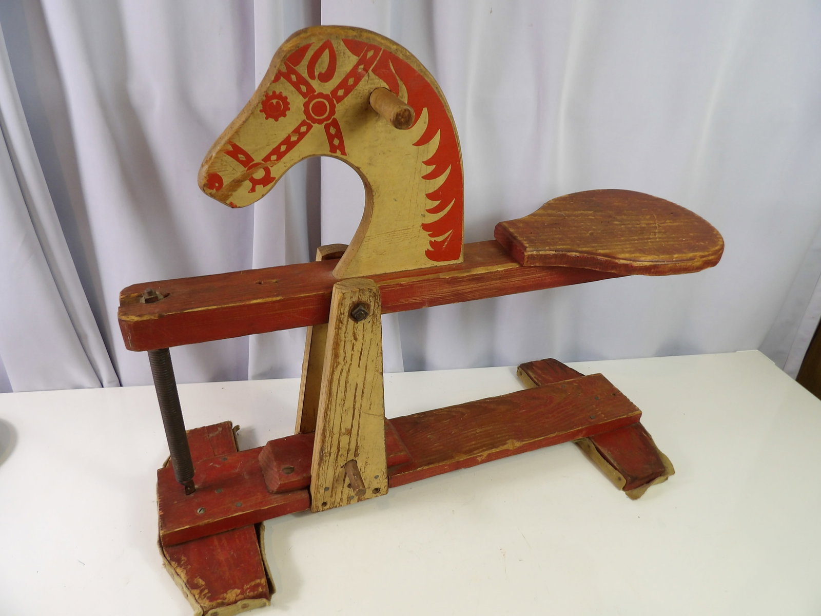 Vintage Children's Wooden Bounce Horse: Vintage Wooden Bounce Horse. Children's Toy with Red and Creme Paint. All measurements approximate. Please see photos for condition and details. Selling as is from 04281.