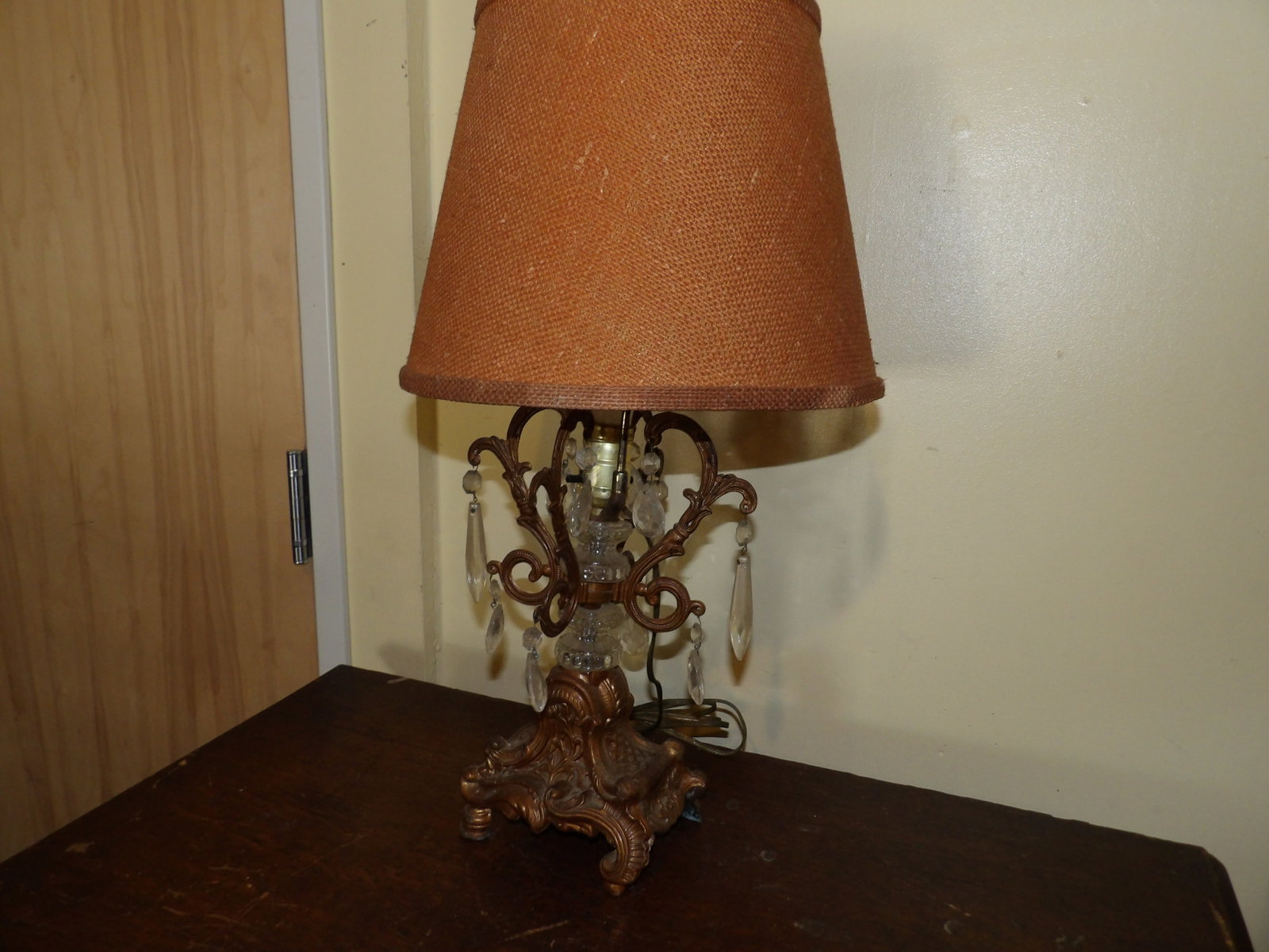 Vintage Hollywood Regency Style Table Lamp: Vintage Hollywood Regency Style Table Lamp with Glass Prisms and Ornate Base. All measurements approximate. Please see photos for condition and details. Selling as is from 04281.