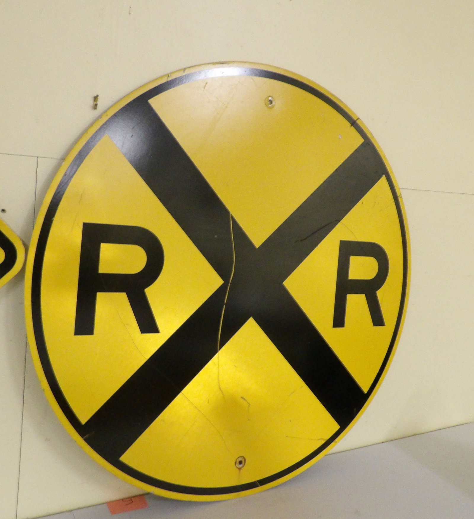 Vintage Railroad Crossing Sign: Vintage Round Yellow 36" Diameter "Railroad Crossing" Sign. All measurements approximate. Please see photos for condition and details. Selling as is from 04281.