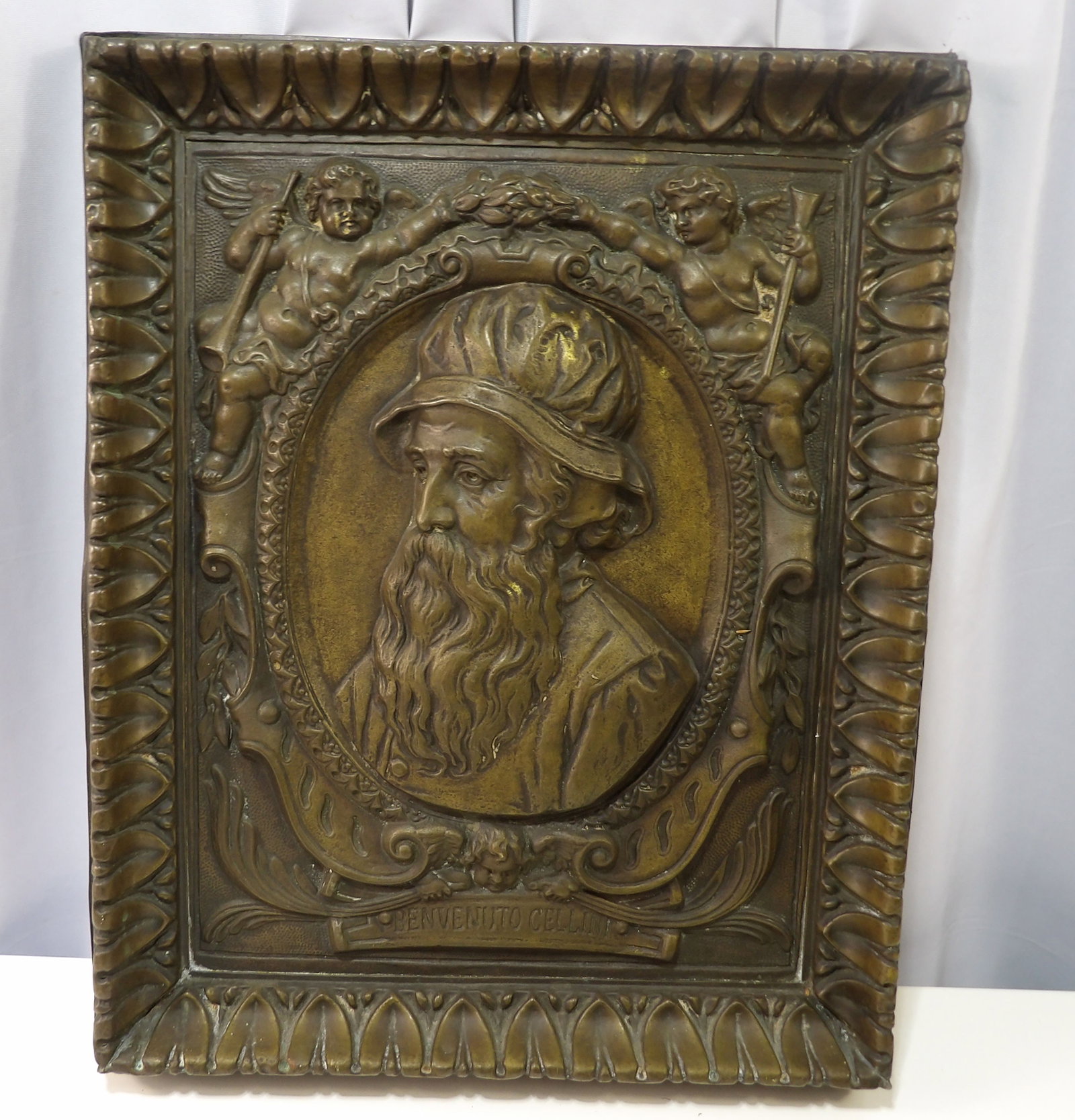 Bronze Relief Plaque of Benvenuto Cellini: Bronze Relief Plaque of Benvenuto Cellini with Ornate Frame. 15" X 19". All measurements approximate. Please see photos for condition and details. Selling as is from 04281.
