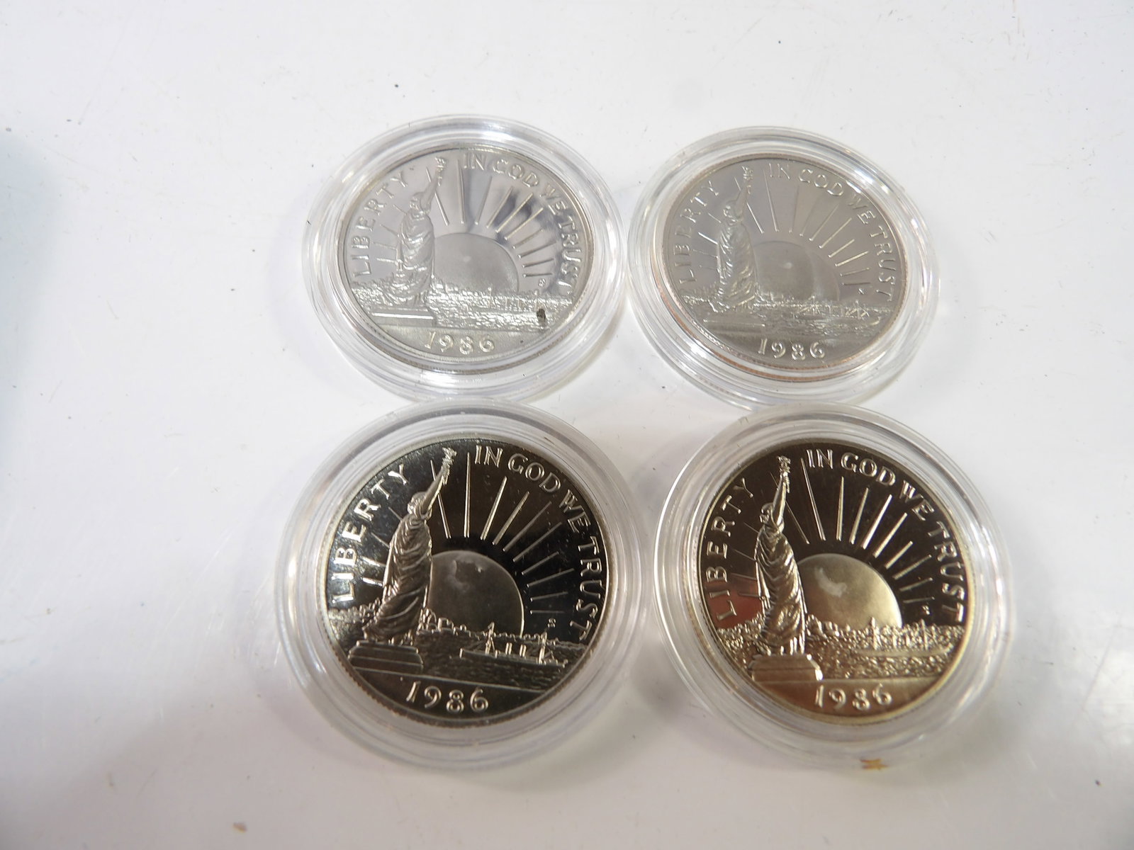 4 PCS.- U. S. Liberty Half-Dollars, Uncirculated: Set of 4 U.S. Liberty Half-Dollars. Uncirculated. All measurements approximate. Please see photos for condition and details. Selling as is from 04281.