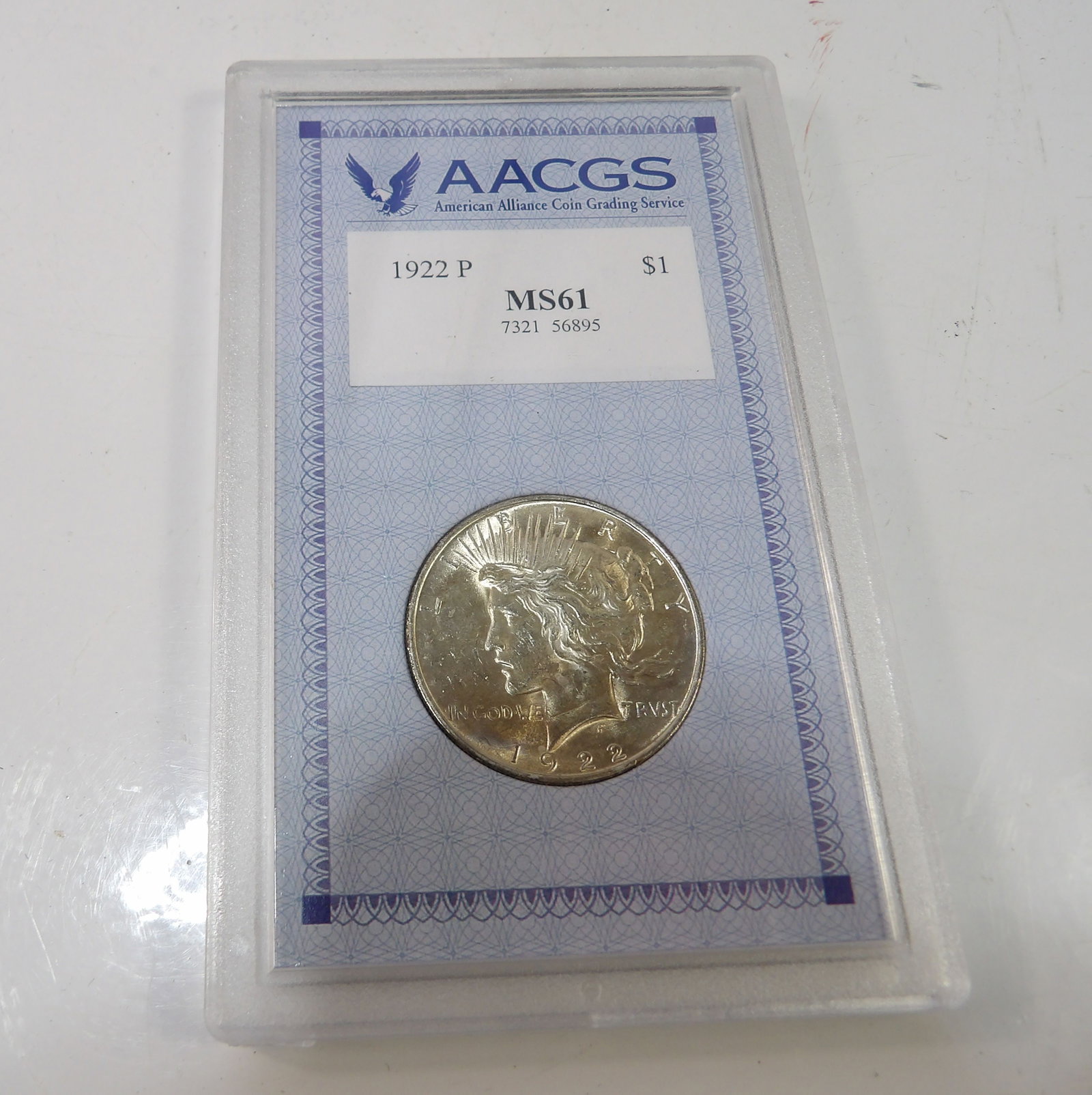 1922P Peace Silver Dollar, MS61: 1922P Peace Silver Dollar. MS61 Graded by AACGS. All measurements approximate. Please see photos for condition and details. Selling as is from 04281.