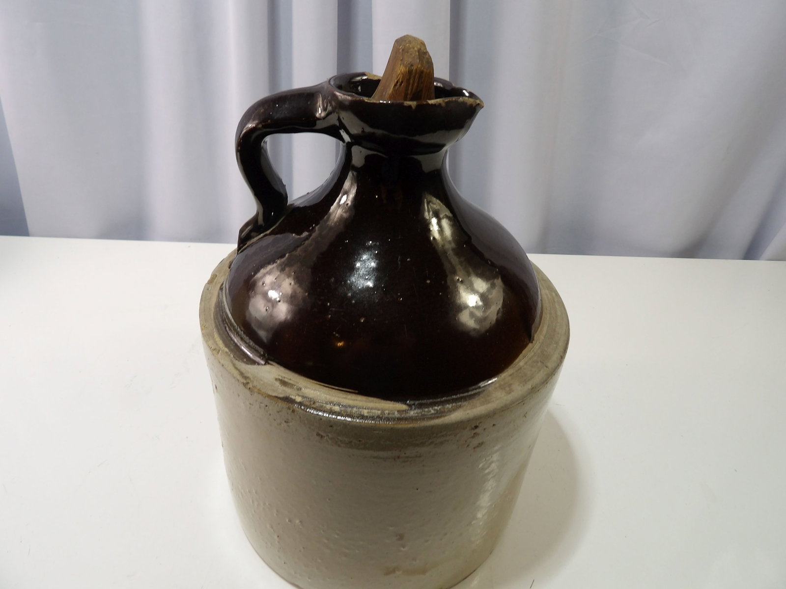 Vintage Two-Toned Jug with Pour Spout: Vintage Two-Toned Jug with Pour Spout and Wooden Stopper. All measurements approximate. Please see photos for condition and details. Selling as is from 04281.