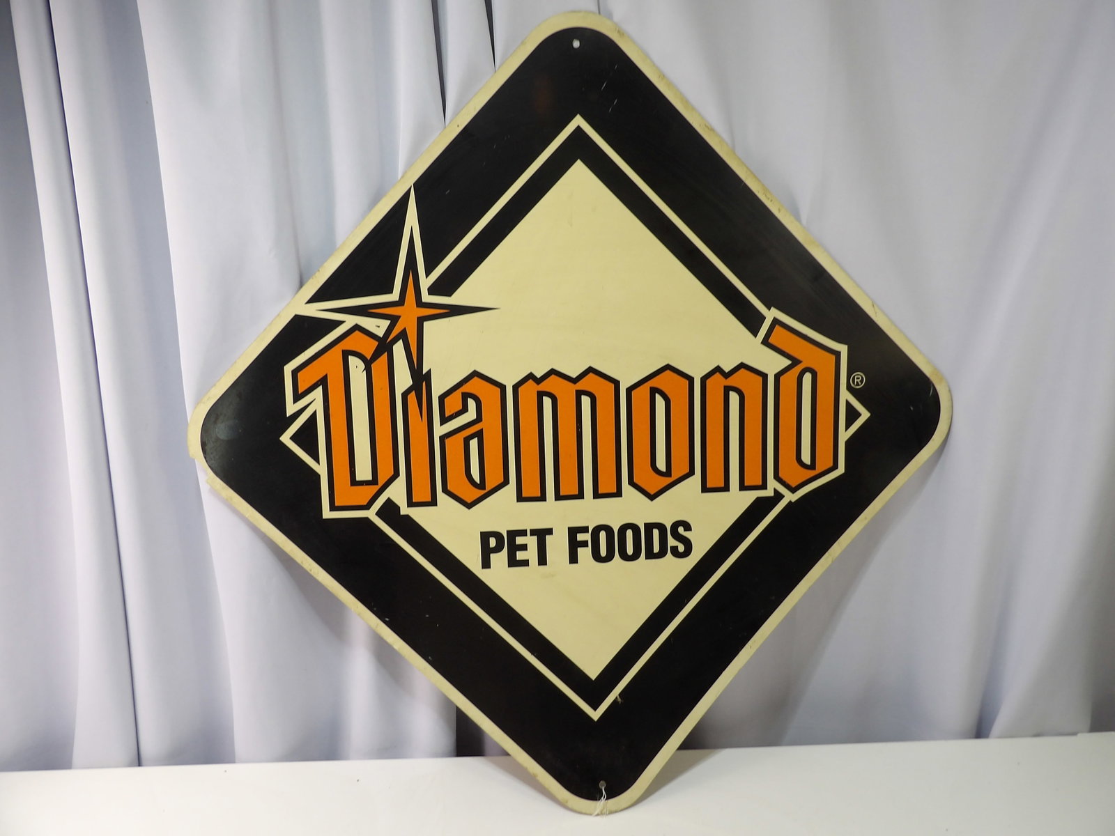 Diamond Pet Foods Sign, 2 Sided: Diamond Pet Foods Sign. Hard Plastic 24" Square, 2-Sided. All measurements approximate. Please see photos for condition and details. Selling as is from 04281.
