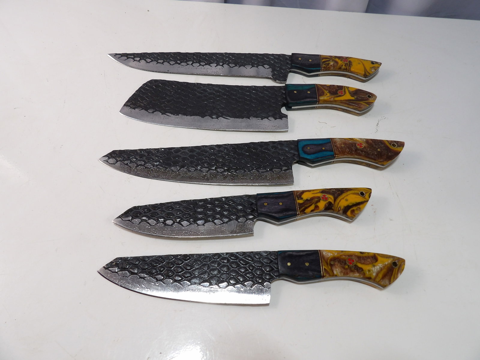 Lot of 5 Handmade Steel Kitchen Knives: Lot of 5 New Handmade Steel Kitchen Knives. All measurements approximate. Please see photos for condition and details. Selling as is from 04281.