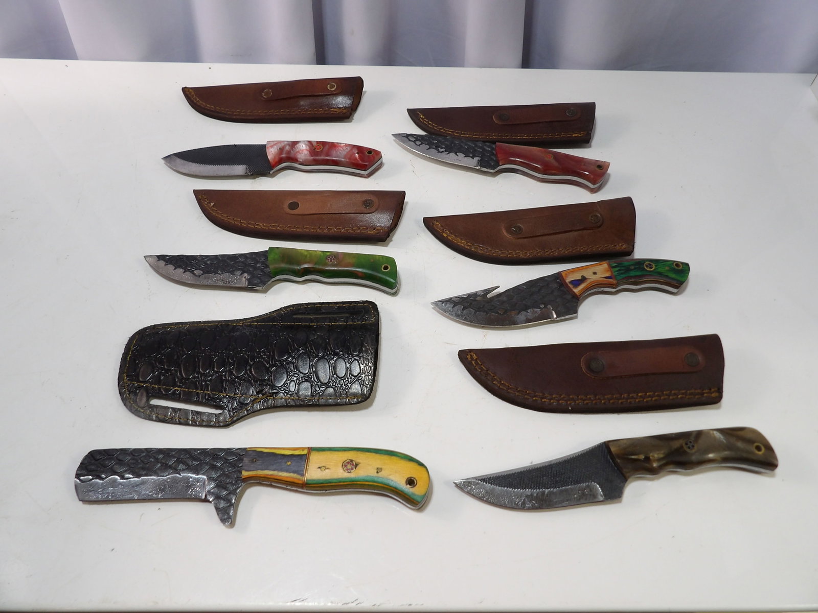 Set of 6 Handmade Steel Knives with Sheaths: Set of 6 New Handmade Steel Knives with Leather Sheaths. All measurements approximate. Please see photos for condition and details. Selling as is from 04281.