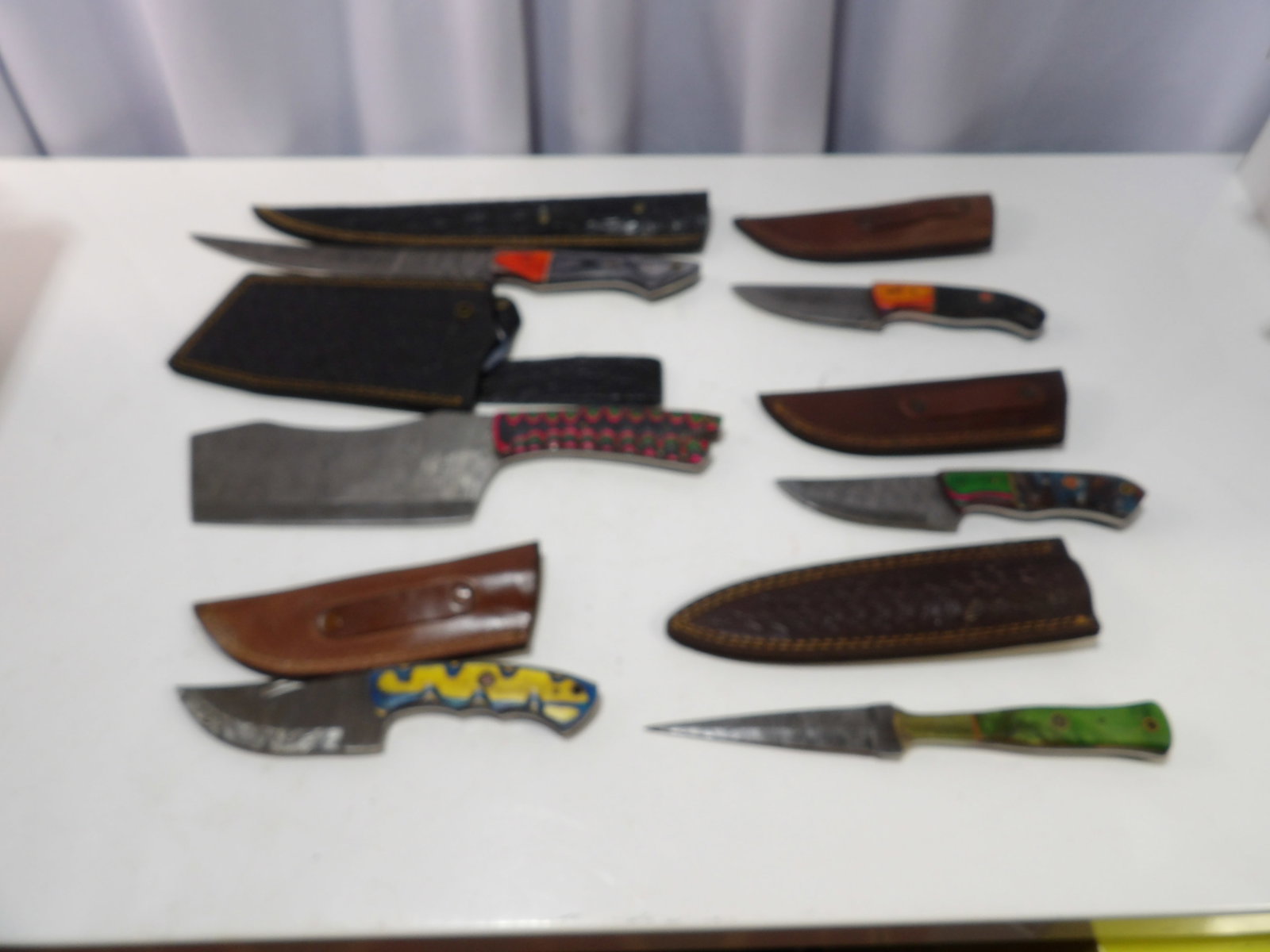 Lot of 6 Handmade Damascus Steel Blades with Sheaths: Lot of 6 New Handmade Damascus Steel Blades with Leather Sheaths. All measurements approximate. Please see photos for condition and details. Selling as is from 04281.
