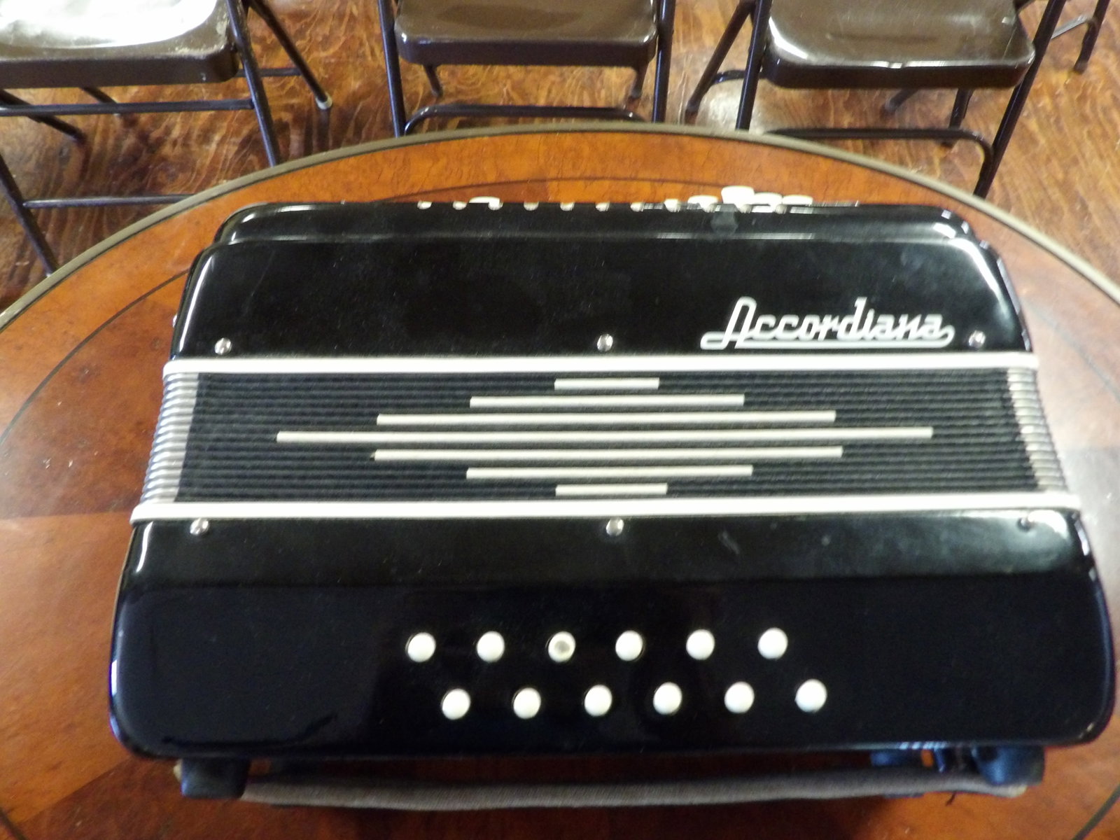 Vintage Acoordiana Accordion with Case: Vintage Accordiana Piano Accordion with Hard Case. All measurements approximate. Please see photos for condition and details. Selling as is from 04281.