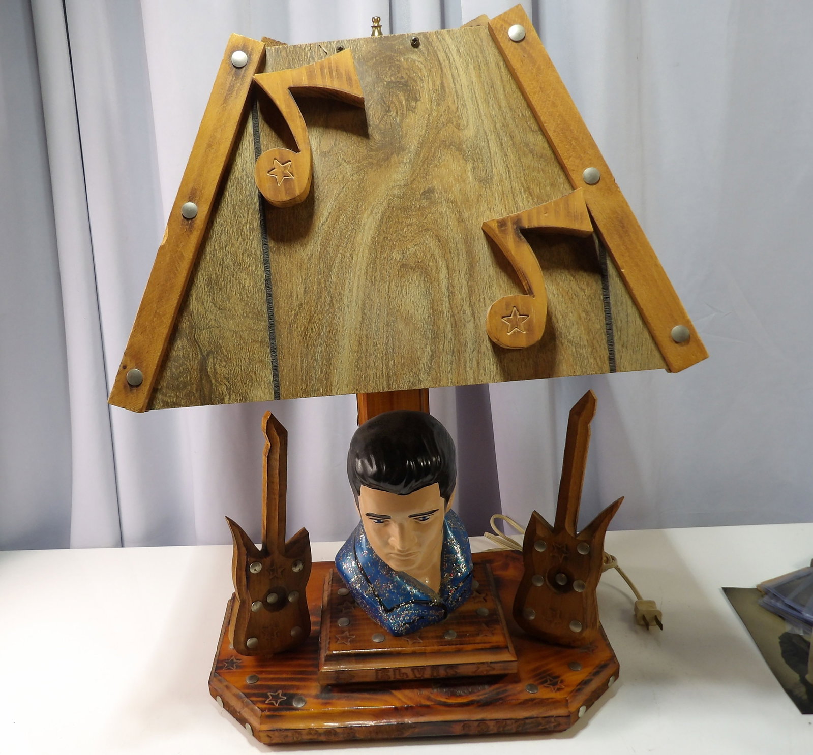 Wooden Elvis Presley Table Lamp: Elvis Presley Themed Wooden Table Lamp with Musical Notes and Guitars. All measurements approximate. Please see photos for condition and details. Selling as is from 04281.