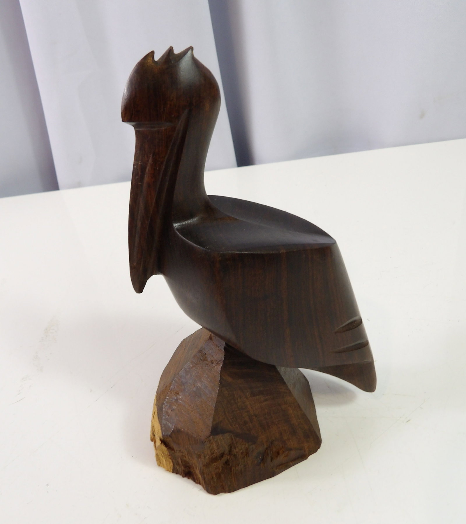Hand Carved Ironwood Pelican: Vintage Hand Carved Ironwood Pelican, 7" tall. All measurements approximate. Please see photos for condition and details. Selling as is from 04281.