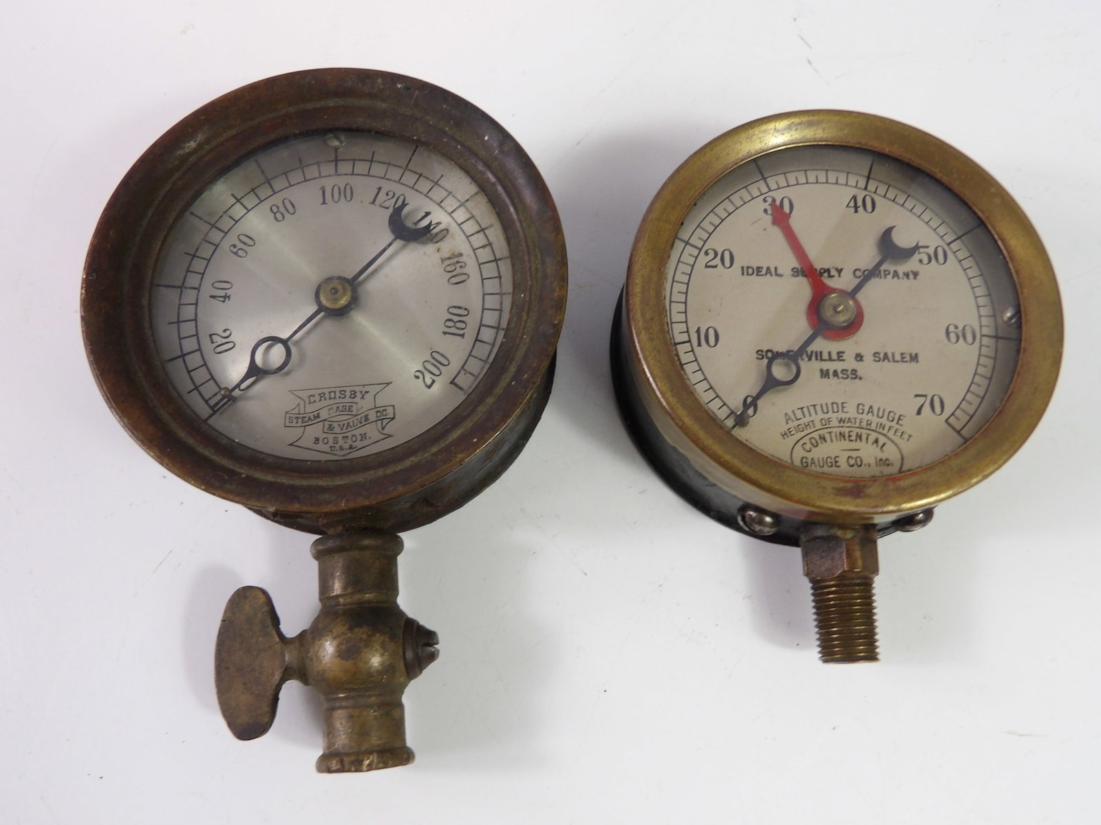 Pair of Antique Gauges: Pair of Antique Gauges. Crosby steam pressure and Continental altitude gauge. All measurements approximate. Please see photos for condition and details. Selling as is from 04281.