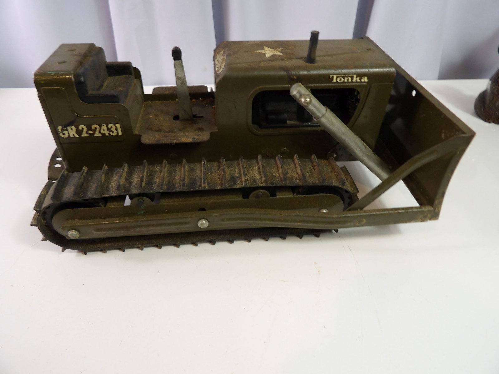 Tonka Military Bulldozer: Vintage Tonka GR2-2431 army green pressed steel military bulldozer. 12" long. All measurements approximate. Please see photos for condition and details. Selling as is from 04281.