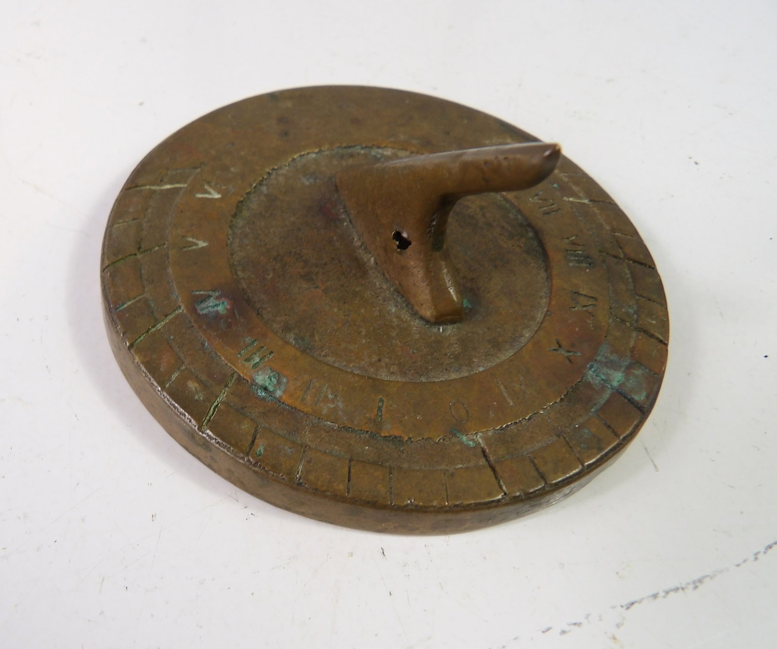 White Swan Brass Sundial: Vintage White Swan Brass Sundial with Roman Numerals, 3" diam. All measurements approximate. Please see photos for condition and details. Selling as is from 04281.