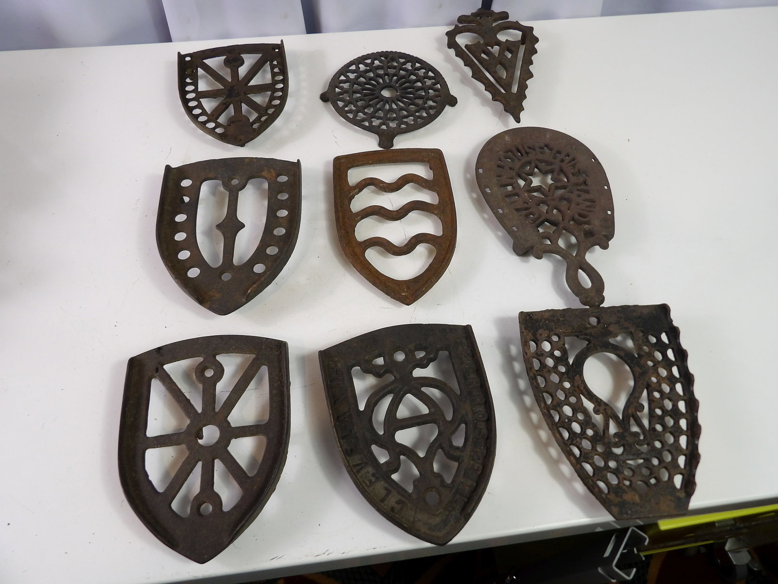 Collection of 9 Cast Iron Trivets (1 of 4)