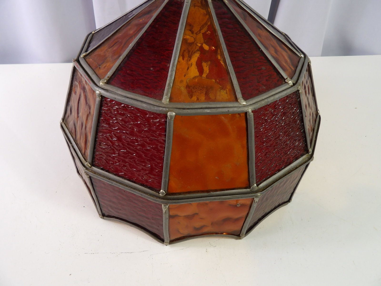 Vintage Stained Glass Hanging Lamp Shade: Vintage Stained Glass Octagon Hanging Lamp Shade in Amber and Red. 11" Diameter. All measurements approximate. Please see photos for condition and details. Selling as is from 04281.