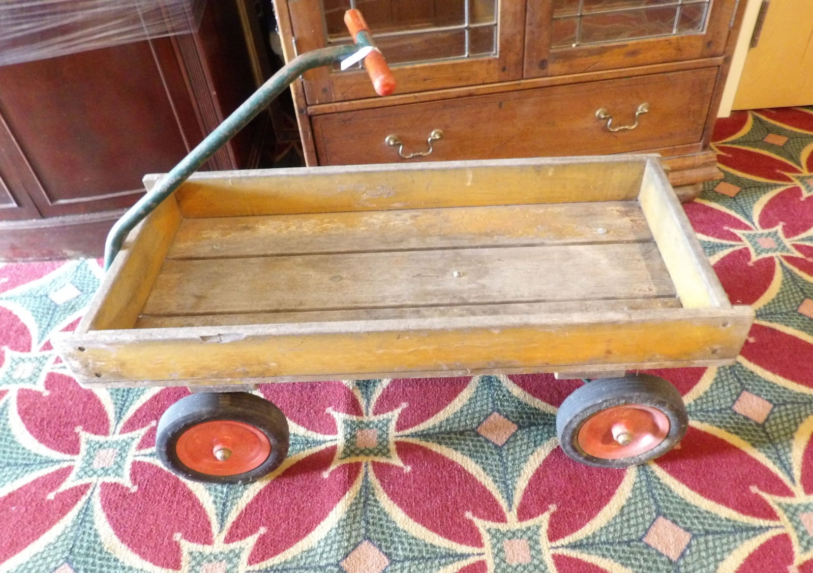 Vintage Wooden Pull Wagon: Vintage Wooden Pull Wagon with Iron Handle. All measurements approximate. Please see photos for condition and details. Selling as is from 04281.