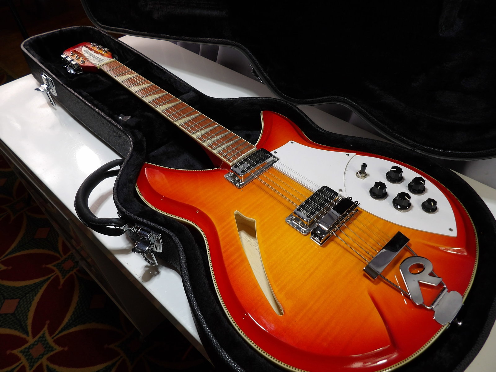 Rickenbacker 360/12 Electric Guitar in FireGlo Finish: Rickenbacker 360/12 Guitar in FireGlo Finish. Excellent Condition with Black Hardshell Case. We are not guitar experts or musicians. This guitar is in like new condition with no visible damage. It has