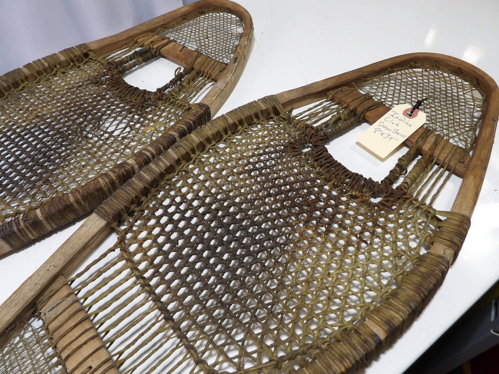 Pair of Indian Club Snowshoes: Vintage Pair of Indian Club Snowshoes. 9" X 34". Maine Made, Very Rare Set. In Great Condition. All measurements approximate. Please see photos for condition and details. Selling as is from 04281.