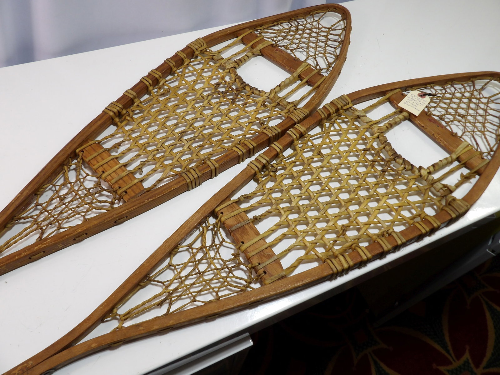 Pair of Maine Made Snowshoes, Ellingwood Turning Co.: Pair of Vintage Maine Made Snowshoes. Ellingwood Turning Co., West Paris, Maine. All measurements approximate. Please see photos for condition and details. Selling as is from 04281.