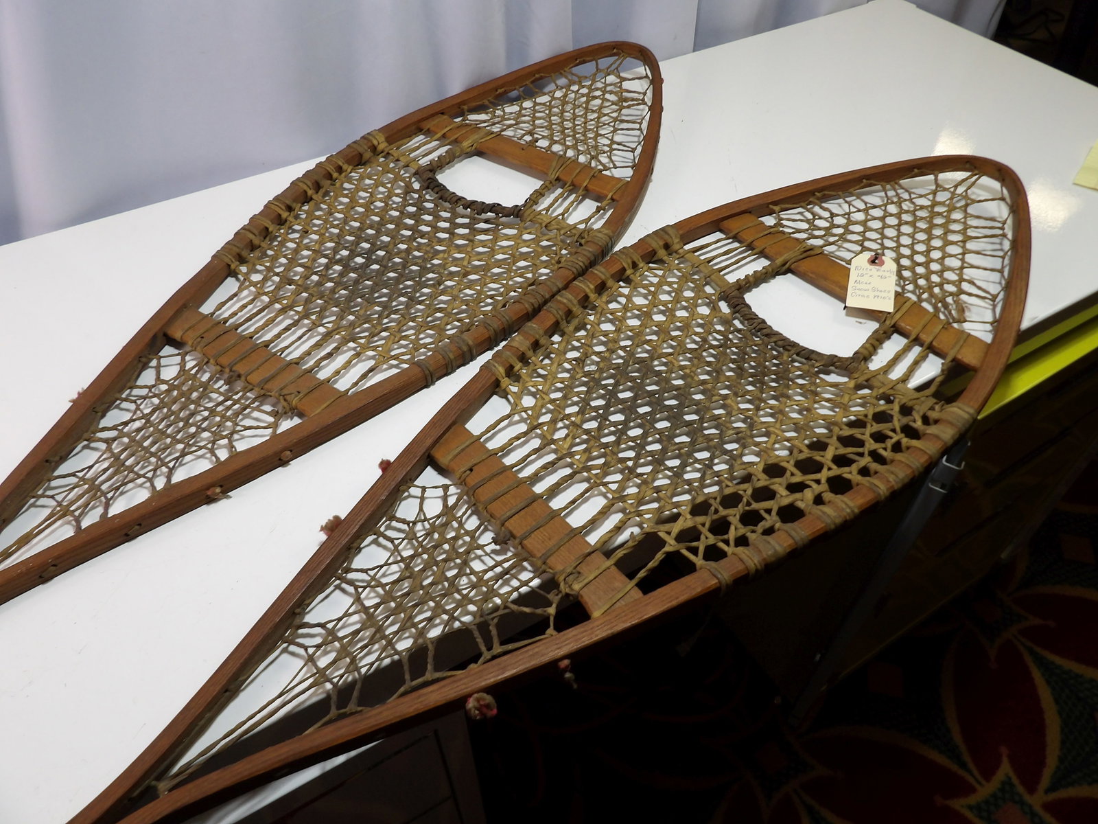 Maine Made Rawhide Snowshoes, c. 1910: Vintage Maine Made Rawhide Snowshoes, from 1910. 12" X 42". In Excellent Condition. All measurements approximate. Please see photos for condition and details. Selling as is from 04281.