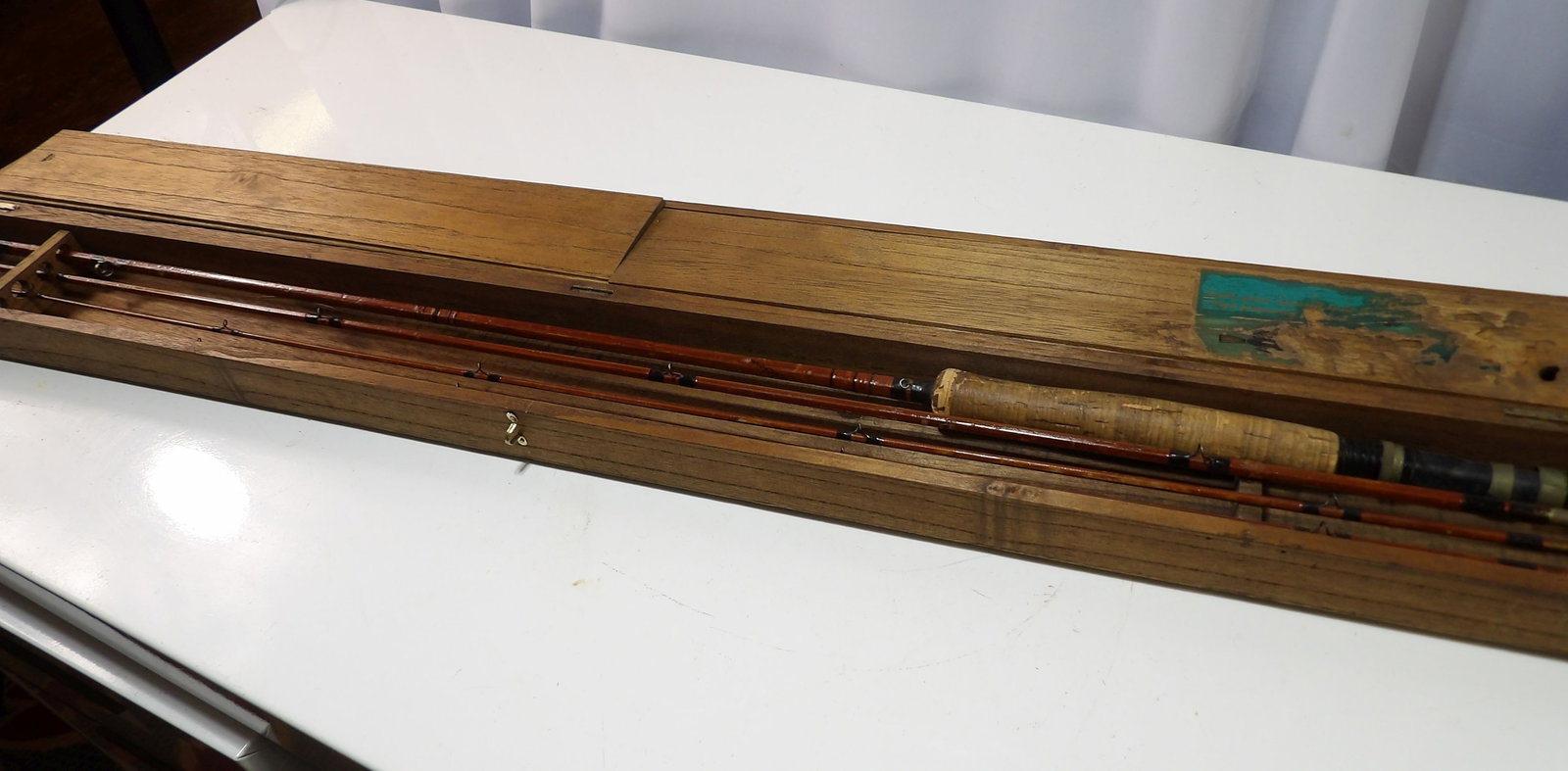 Bamboo Fly Fishing Rod and Case: Vintage Bamboo Multi-Piece Fly Fishing Rod in a Great Wooden Case. All measurements approximate. Please see photos for condition and details. Selling as is from 04281.