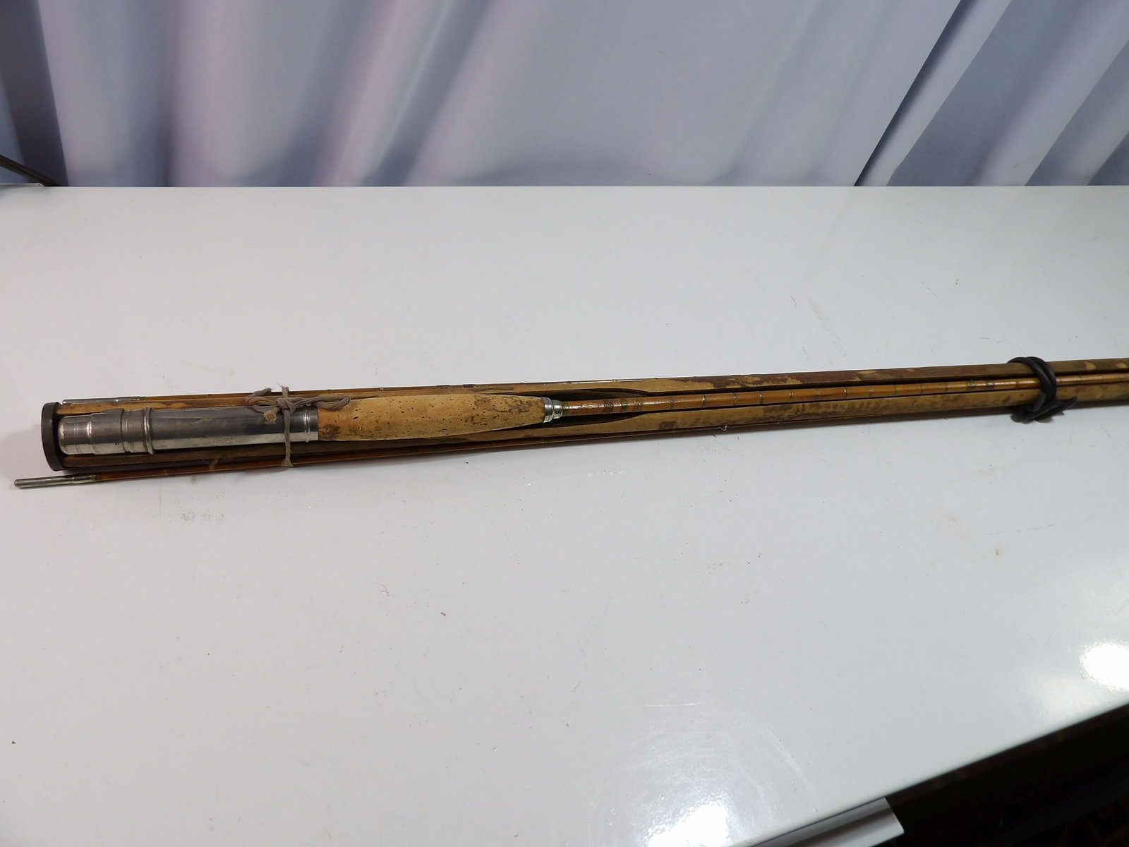 Cane Fly Rod with 2 Tips: Cane Fly Rod with 2 Tips and Holder. All measurements approximate. Please see photos for condition and details. Selling as is from 04281.