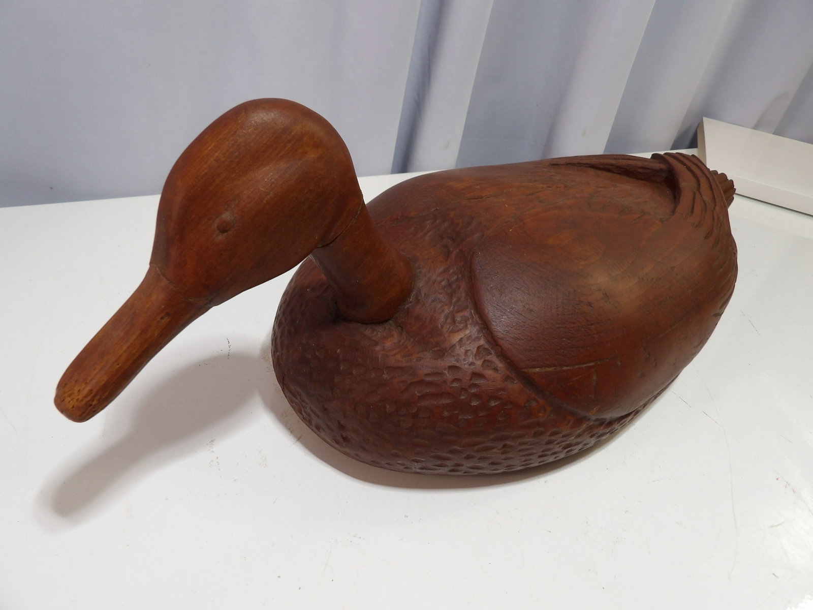 Hand Carved Wooden Duck Decoy: Vintage Hand Carved Wooden Duck Decoy with Dark Wood Finish. All measurements approximate. Please see photos for condition and details. Selling as is from 04281.