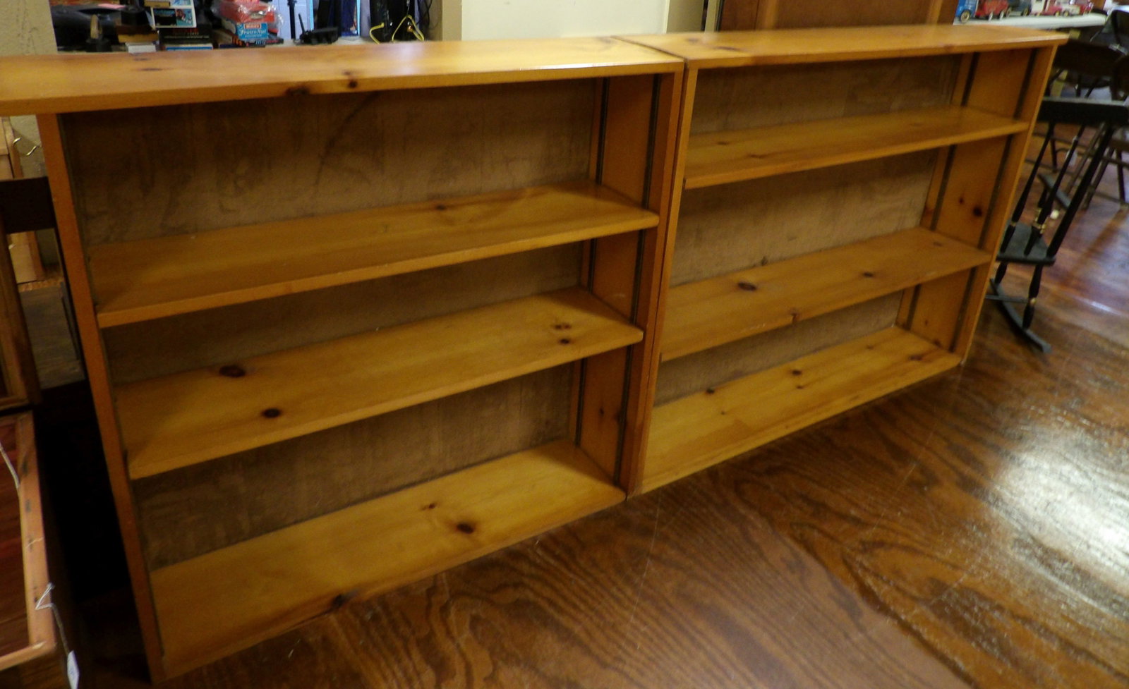 2 Piece Pine Bookcase with Adjustable Shelves: 90" Long Pine Bookcase with Adjustable Shelves in Two Pieces. Solid Bookcase. All measurements approximate. Please see photos for condition and details. Selling as is from 04281.