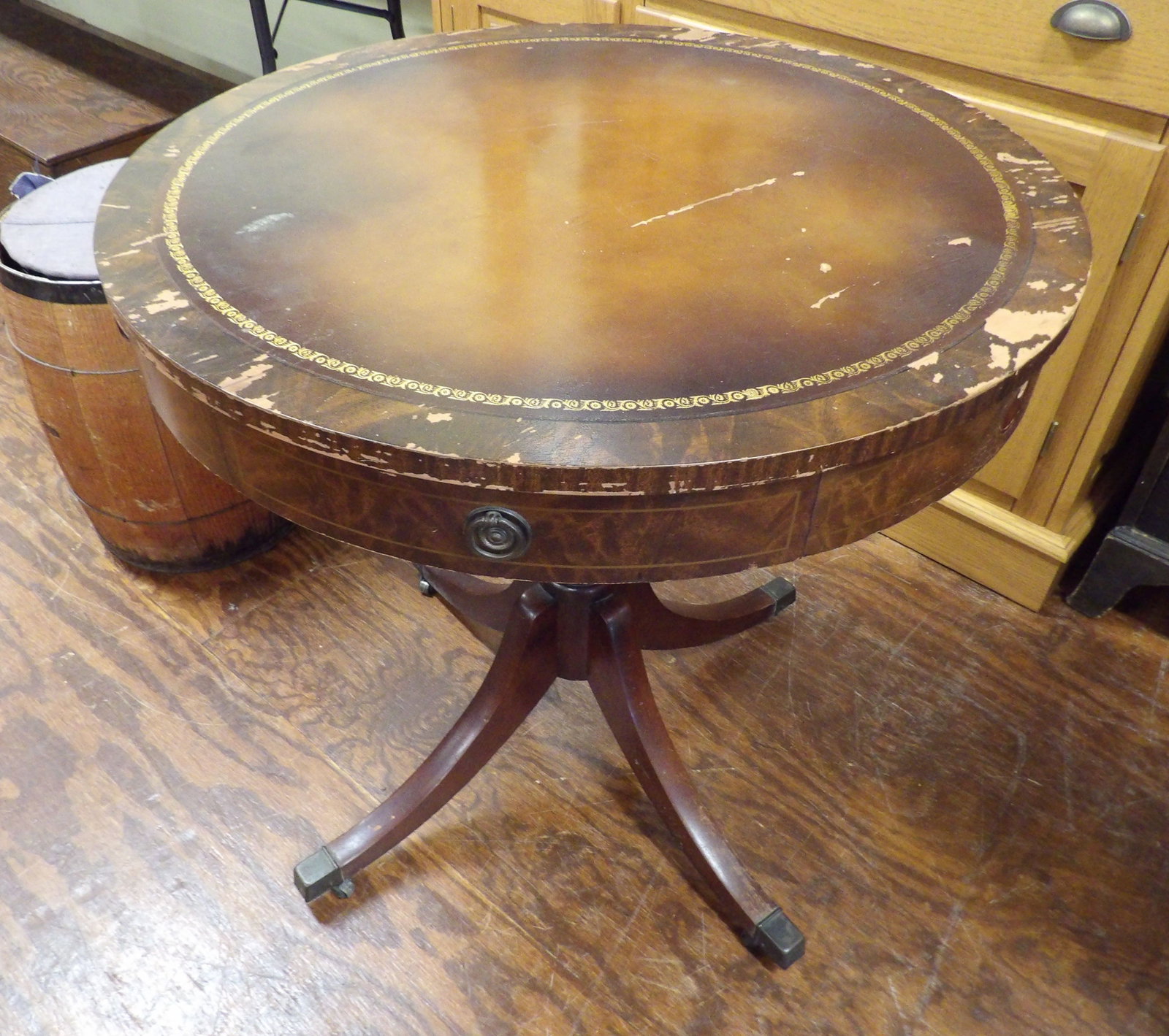 Mahogany Drum Table with Leather Top and Pedestal Base: Vintage Mahogany Drum Table with Leather Top and Pedestal Base. 28" Diameter. All measurements approximate. Please see photos for condition and details. Selling as is from 04281.
