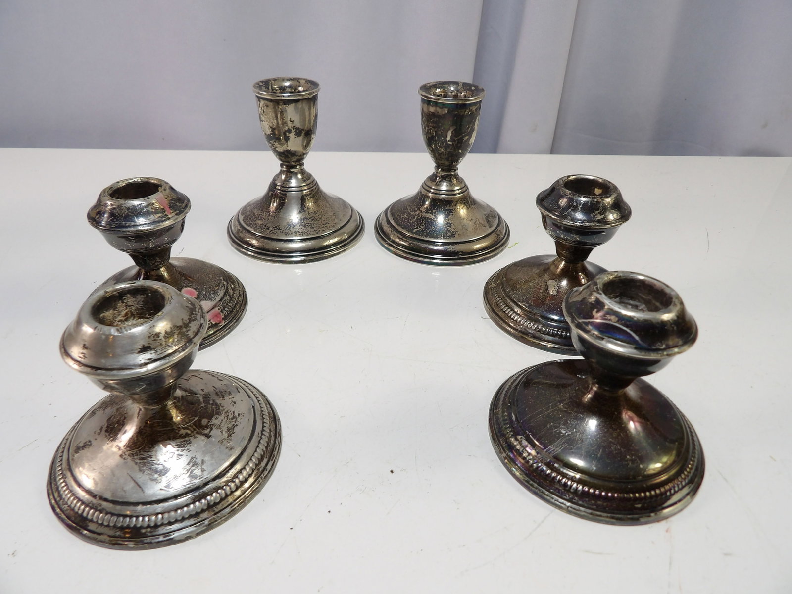 3 Sets of Sterling Candlestick Holders: 3 Sets of Weighted Sterling Candlestick Holders. All measurements approximate. Please see photos for condition and details. Selling as is from 04281.