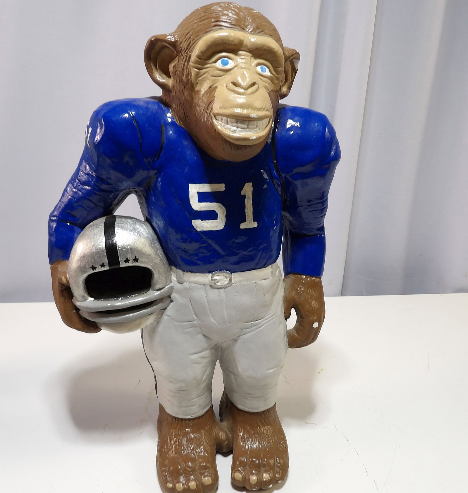 Ceramic Football Monkey Figurine: Vintage Heavy Ceramic Football Monkey Figurine. 14" Tall. All measurements approximate. Please see photos for condition and details. Selling as is from 04281.