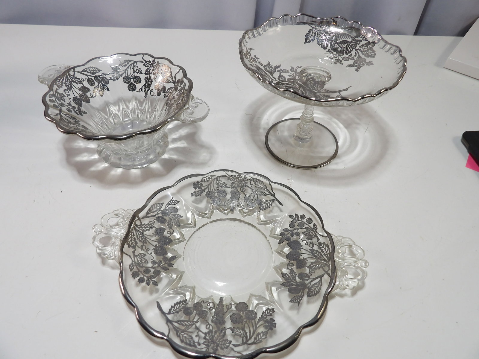 3 Piece Sterling Silver Overlay Glass Dessert Set: Vintage 3 Piece Sterling Silver Overlay Glass Berry and Vine Dessert Set, Marked Sterling. All measurements approximate. Please see photos for condition and details. Selling as is from 04281.
