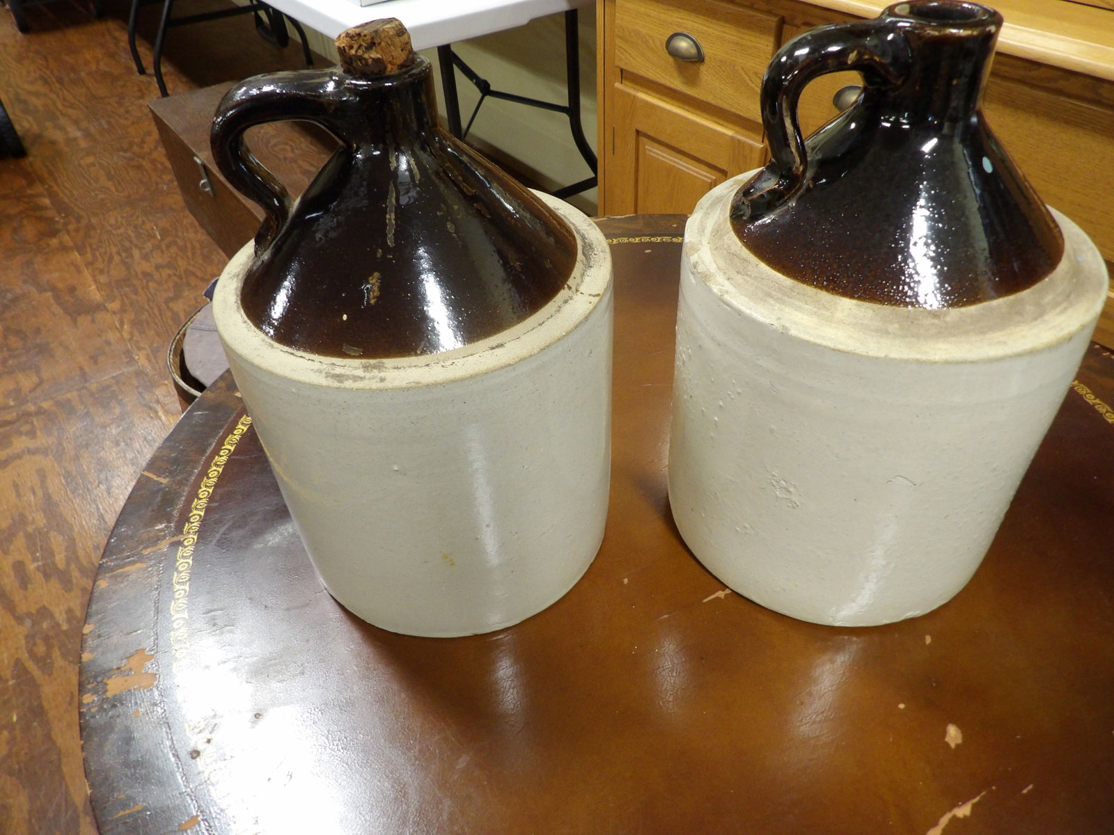 Pair of Brown & Tan Glazed Stoneware Jugs: Pair of Brown and Tan Glazed Stoneware Jugs. All measurements approximate. Please see photos for condition and details. Selling as is from 04281.