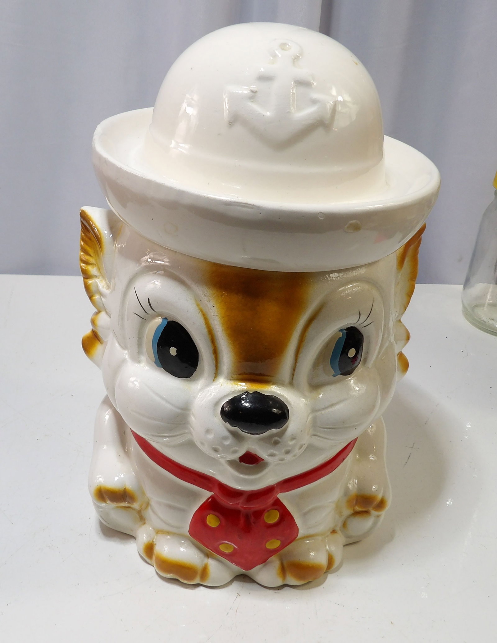 Sailor Mouse Cookie Jar: Vintae Ceramic Sailor Mouse Cookie Jar, with Anchor Hat and Red Bow Tie. All measurements approximate. Please see photos for condition and details. Selling as is from 04281.