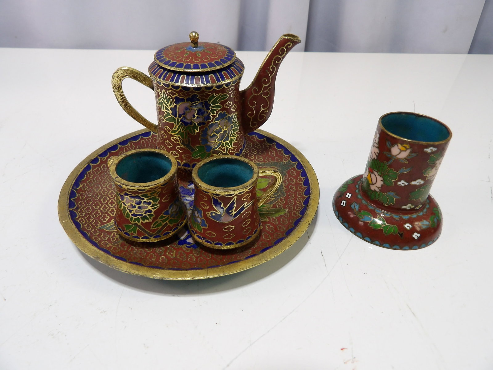 Cloisonne Miniature Tea Set with Tray and Vase: Vintage Cloisonne Miniature Tea Set with Hand painted Tray and Vase. All measurements approximate. Please see photos for condition and details. Selling as is from 04281.