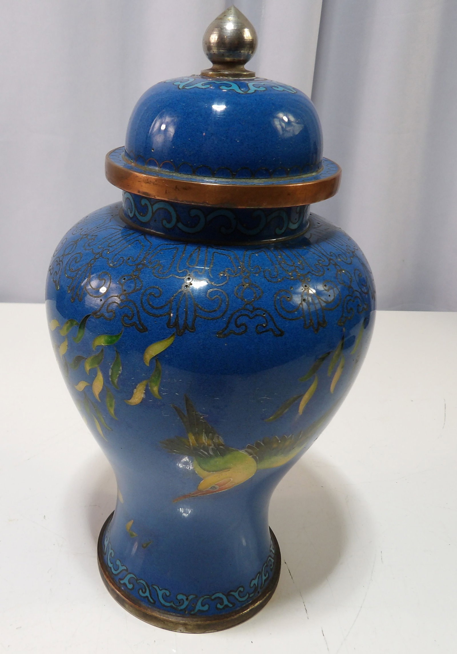 Chinese Cloisonne Ginger Jar: Antique Chinese Brass Blue Cloisonne Ginger Jar with Bird and Floral Motif. All measurements approximate. Please see photos for condition and details. Selling as is from 04281.