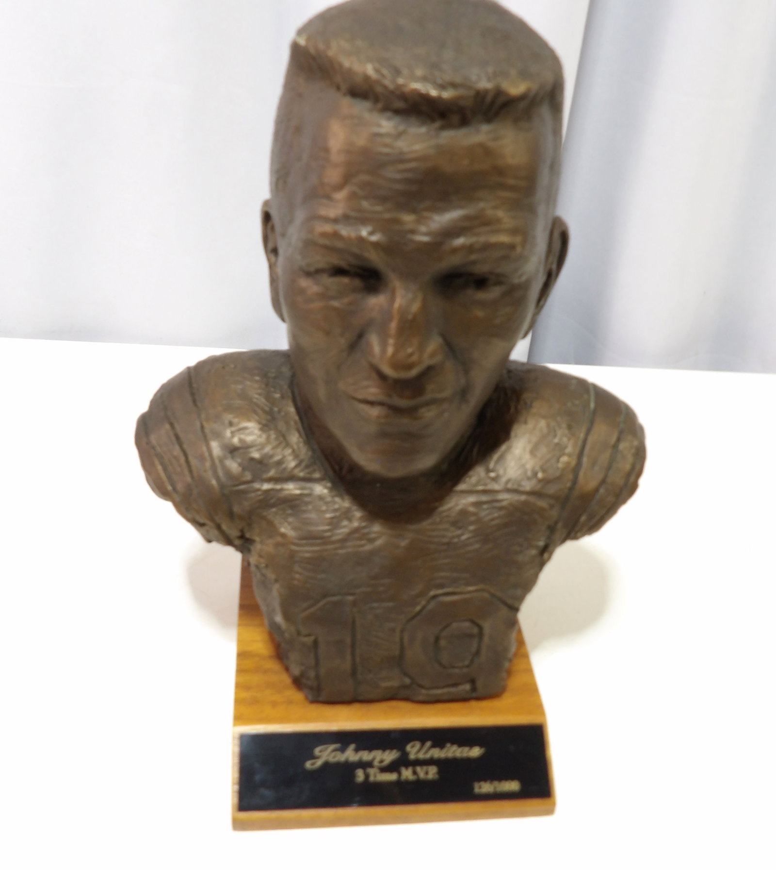 Johnny Unitas Bronze Bust: Johnny Unitas Bronze Bust Figure Statue. #126/1000. All measurements approximate. Please see photos for condition and details. Selling as is from 04281.