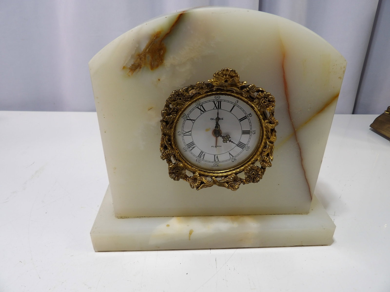 Globe Quartz Alarm Clock: Vintage Globe Quartz Alarm Clock with Gilded Brass Bezel on Onyx Base. All measurements approximate. Please see photos for condition and details. Selling as is from 04281.