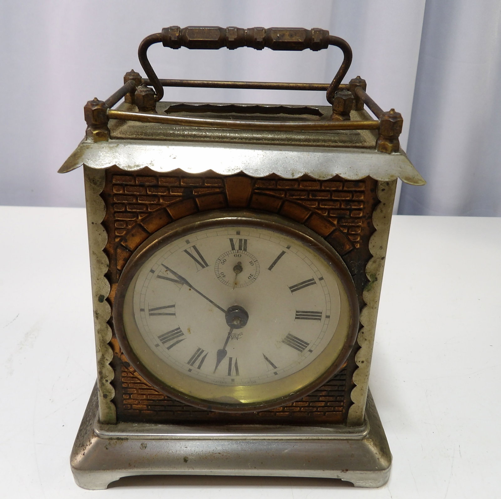 Industrial Style Carriage Clock with Roman Numerals: Vintage Industrial Style Carriage Clock with Roman Numerals and Brick Motif. Has one Side Piece of Glass. All measurements approximate. Please see photos for condition and details. Selling as is from 