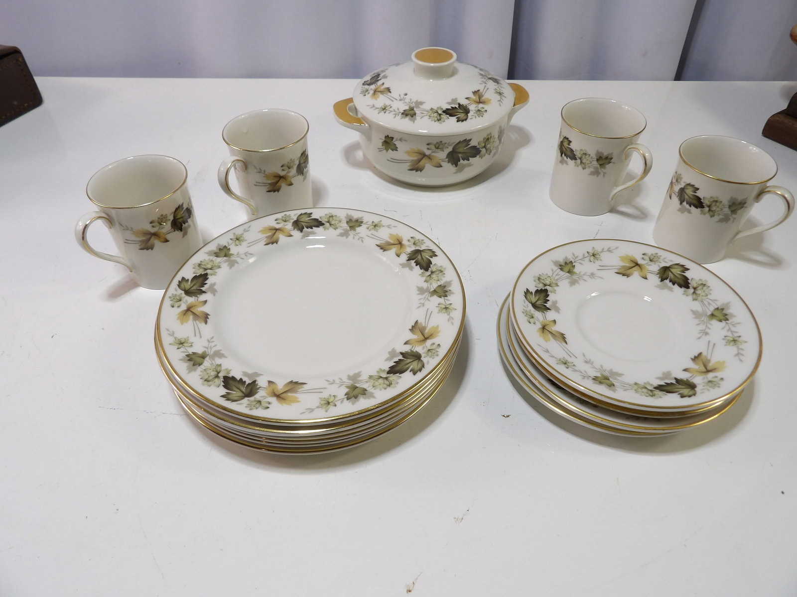 Royal Doulton "Larchmont" Tableware Set: Royal Doulton "Larchmont" Tableware Set with Autumn Leaf Motif and Gold Trim. All measurements approximate. Please see photos for condition and details. Selling as is from 04281.