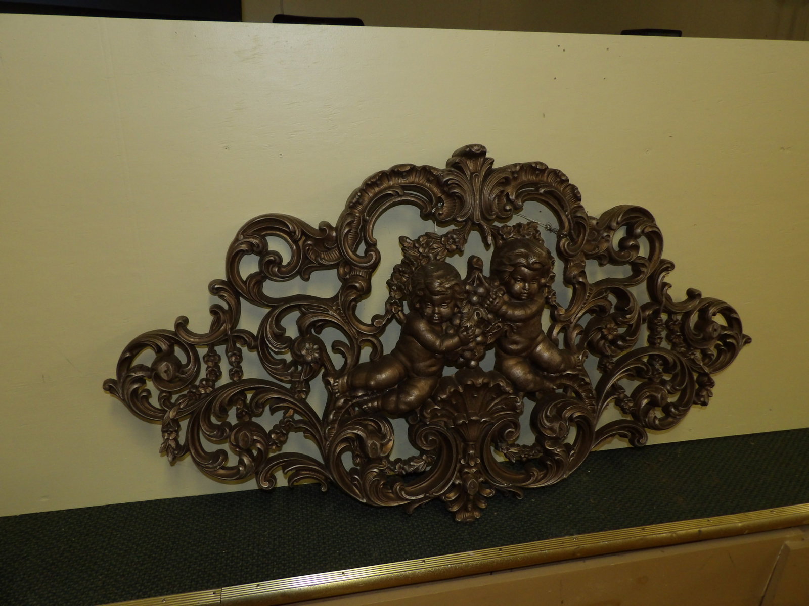 Hollywood Regency Style Cupid Cherub Wall Hanging: Vintage Hollywood Regency Style Cupid Cherub Wall Hanging Aluminum/Plastic, 29" X 52". All measurements approximate. Please see photos for condition and details. Selling as is from 04281.