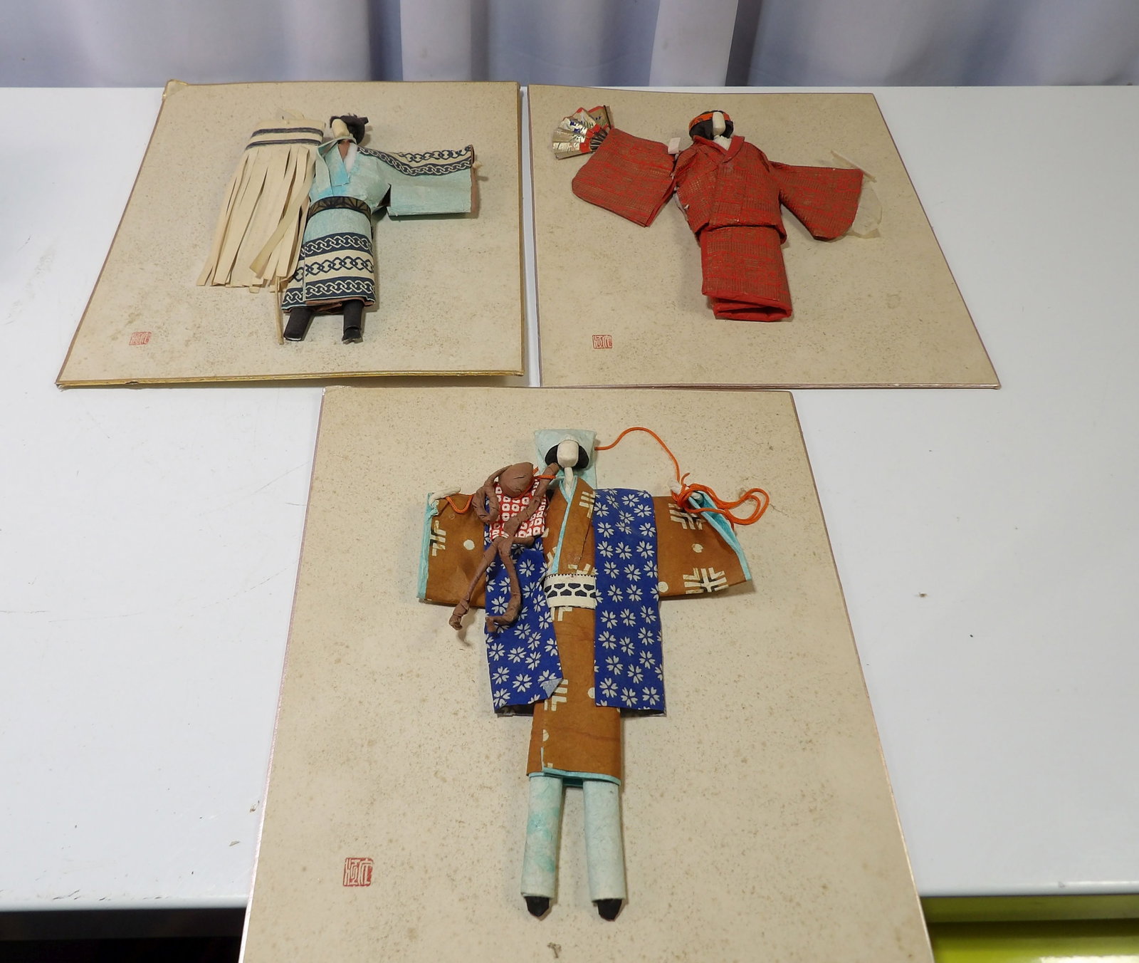 Set of 3 Japanese Oshi-E Pictures: Set of 3 Vintage Japanese Oshi-E Pictures on Shikishi Boards. All measurements approximate. Please see photos for condition and details. Selling as is from 04281.