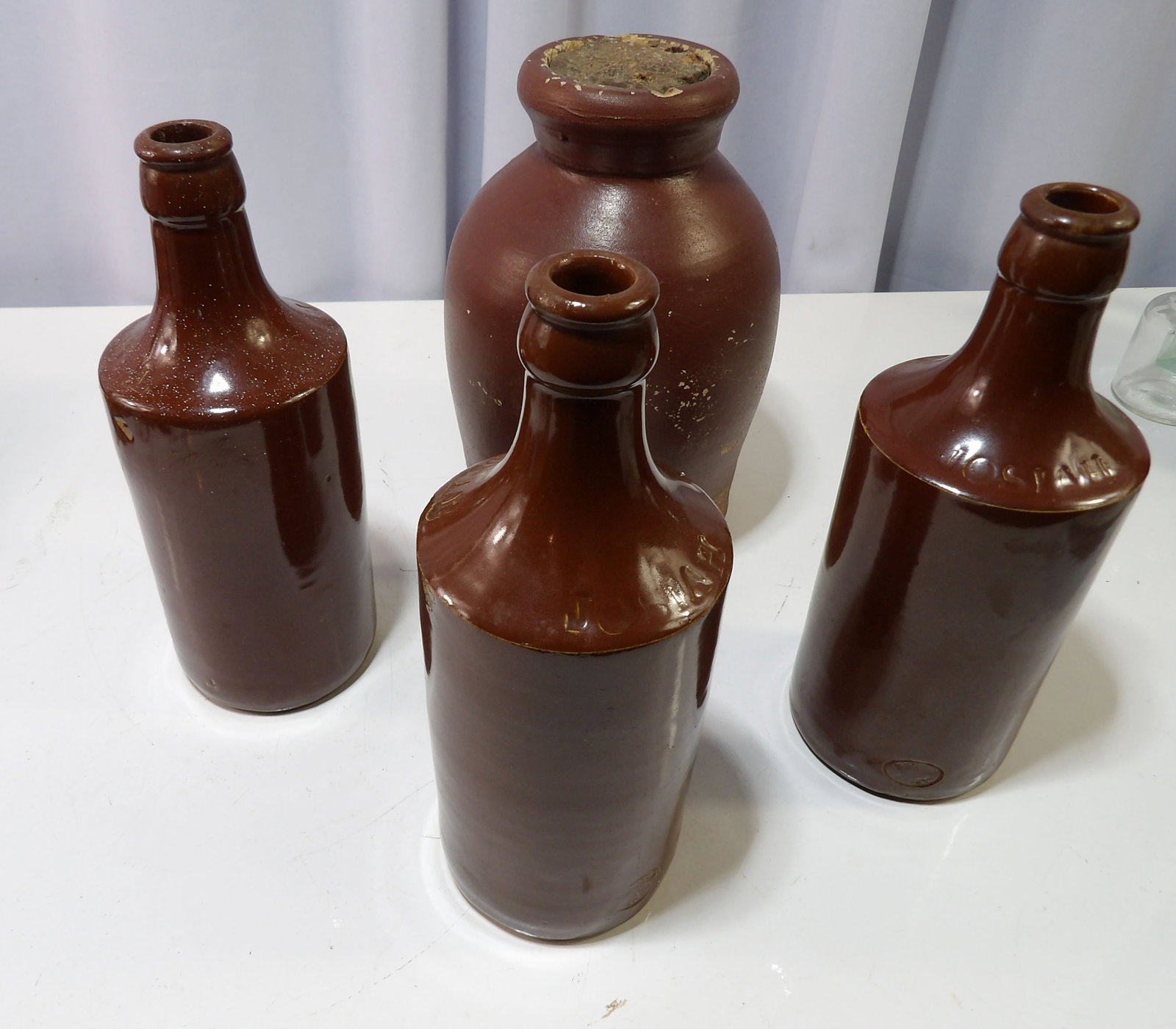 Collection of Stoneware Bottles: Collection of Vintage Stoneware Bottles. All measurements approximate. Please see photos for condition and details. Selling as is from 04281.