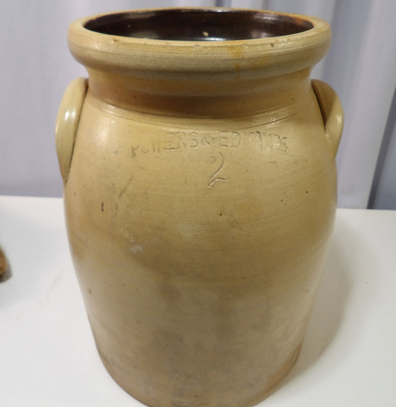 Powers & Edmans 2 Gallon Stoneware Crock: Vintage Powers & Edmans Stoneware 2 Gallon Crock with Handles. All measurements approximate. Please see photos for condition and details. Selling as is from 04281.