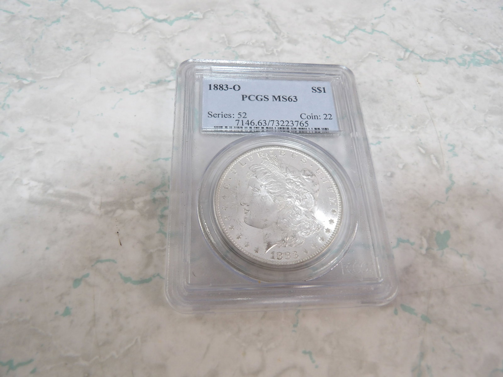 1883-0 Morgan Silver Dollar: 1883-0 Morgan Silver Dollar, PCGS MS63. All measurements approximate. Please see photos for condition and details. Selling as is from 04281.