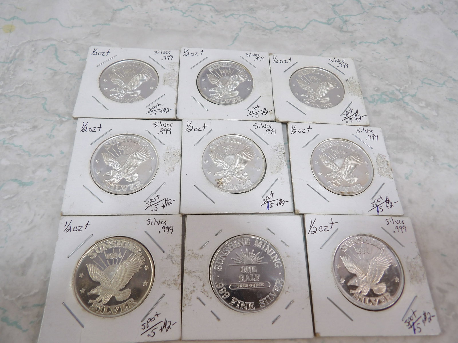 Collection of 9 1984 Sunshite Mining 1/2 Oz. Silver Rounds: Collection of 9 1984 Sunshine Mining, 1/2 Oz. .999 Fine Silver Rounds. All measurements approximate. Please see photos for condition and details. Selling as is from 04281.