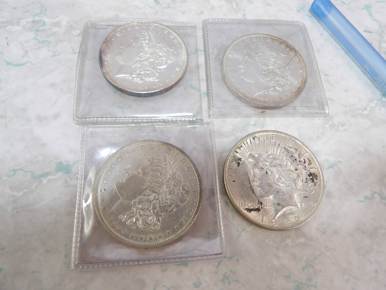 3 Early Morgan Silver Dollars (1880, 1881, 1890) and 1 Silver Peace Dollar (1922): 3 Early Morgan Silver Dollars 1880, 1881, 1890, and 1 Silver Peace Dollar. Peace Dollar is 1922. All measurements approximate. Please see photos for condition and details. Selling as is from 04281.