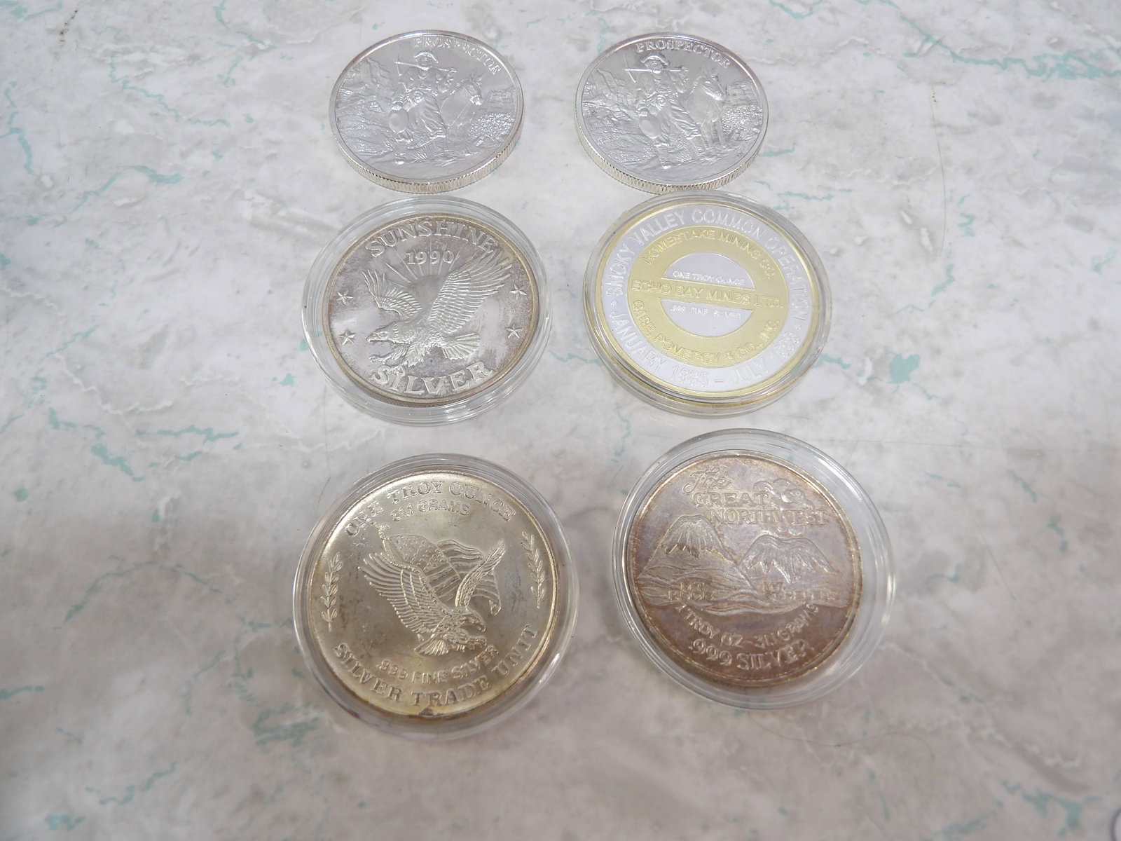 Collection of 6 1 Troy Oz. Silver Rounds: Collection of 6 1 Troy Oz. Silver Rounds, Various Designs. All measurements approximate. Please see photos for condition and details. Selling as is from 04281.