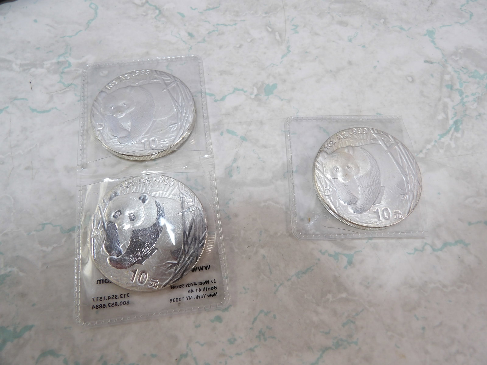 3 2001 Chinese Panda 1 Troy Oz. Silver Rounds: 3 2001 1 Troy Oz. Silver Rounds. Chinese Panda 10 Yuan Coins. All measurements approximate. Please see photos for condition and details. Selling as is from 04281.